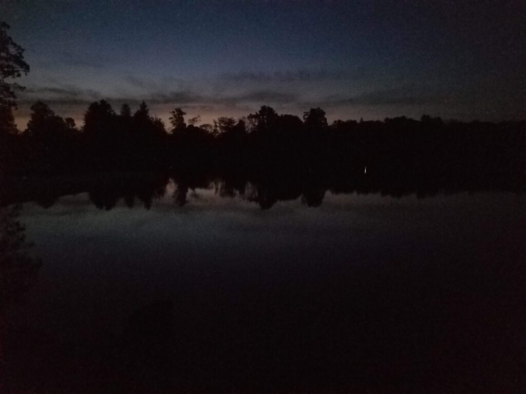dawn picture of Lake Wononscopomuc looking east as the sky (and the relection in the water) just barely start to lighten
